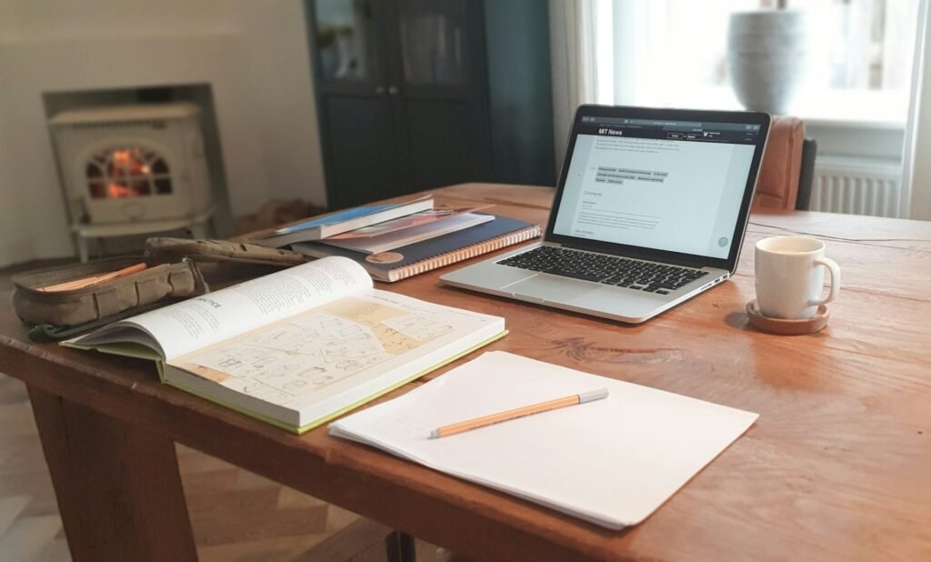 Professional workspace with laptop displaying accessibility testing tools, color contrast checker on screen, and WCAG guidelines reference materials on desk