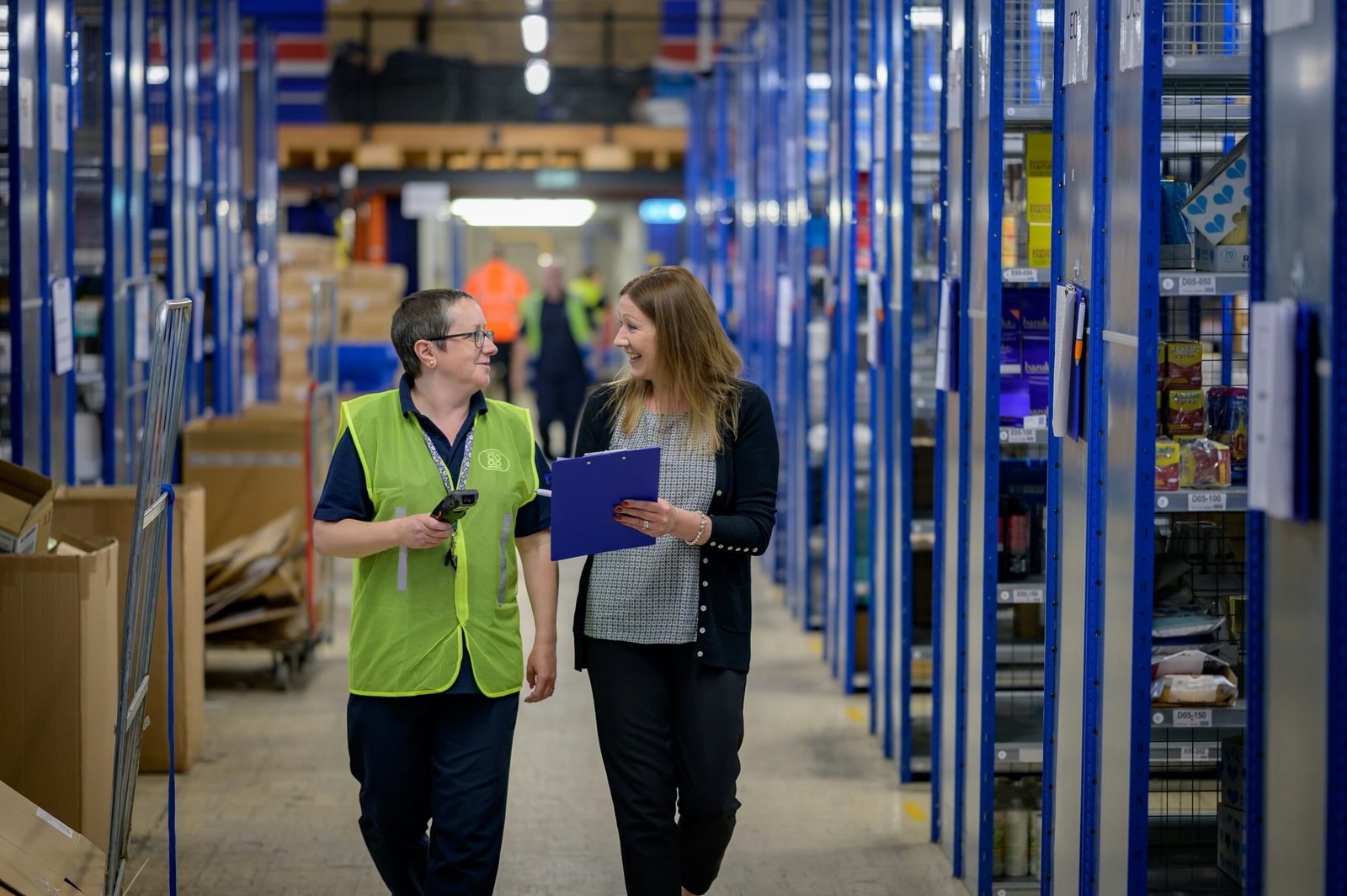Modern automated warehouse or fulfillment center with robotic systems and conveyor belts efficiently moving products, representing seamless e-commerce automation